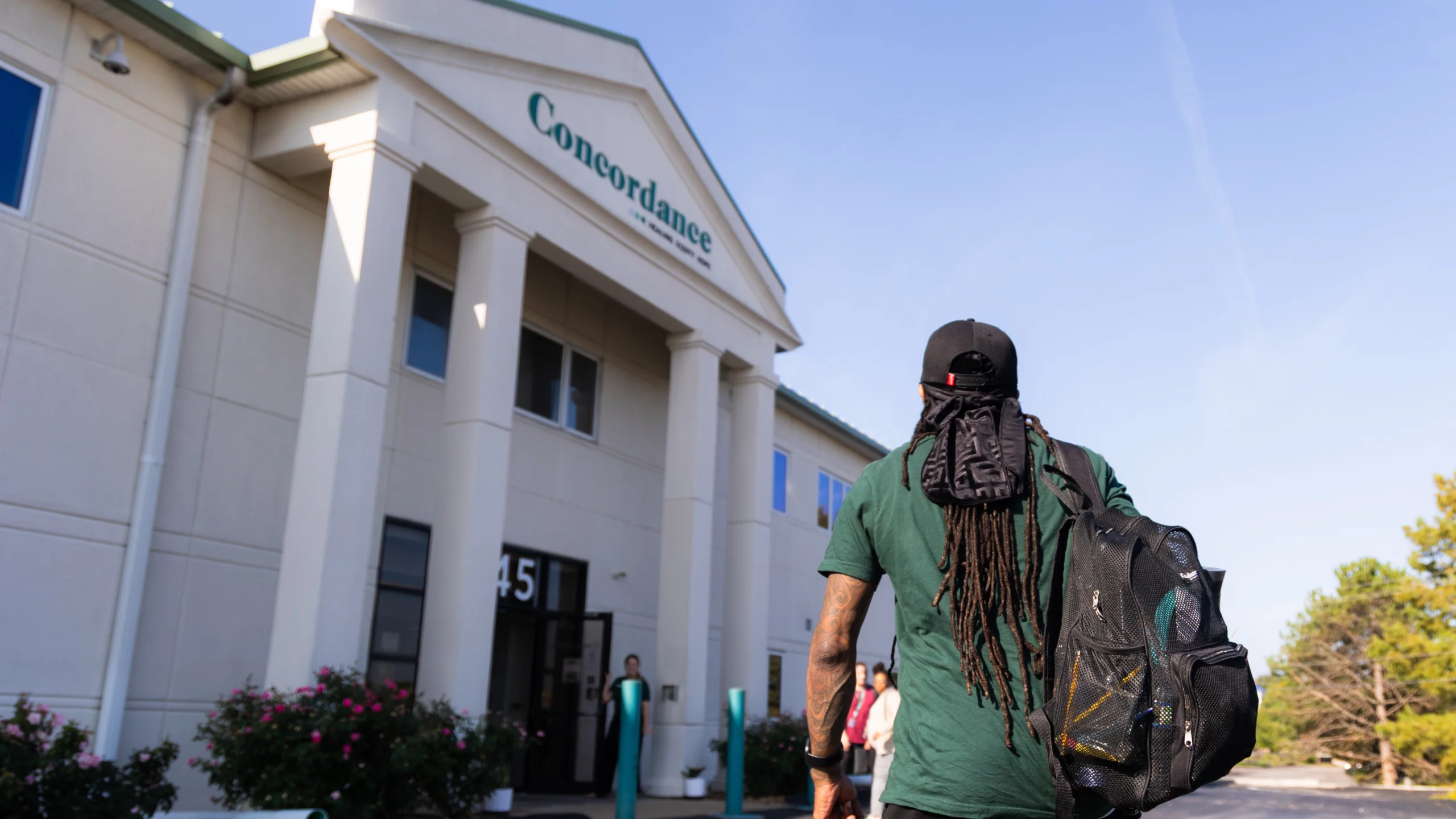 A person walking into concordance's building