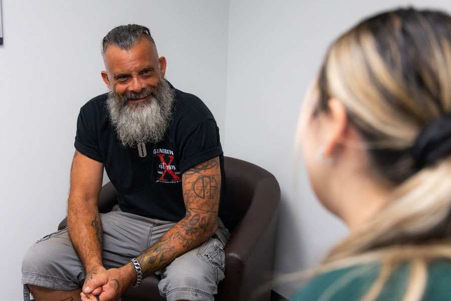 A man talking with a woman.