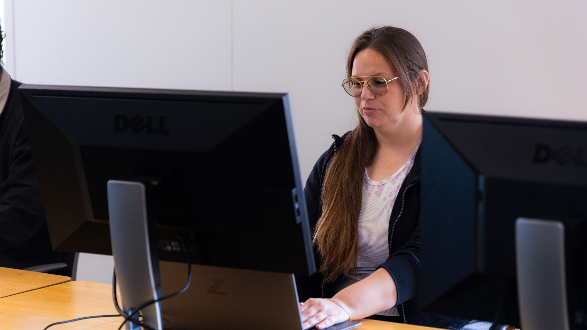 Concordance---Sept.-2025-155-Liz-Mayer_WEB Woman sitting at desk typing