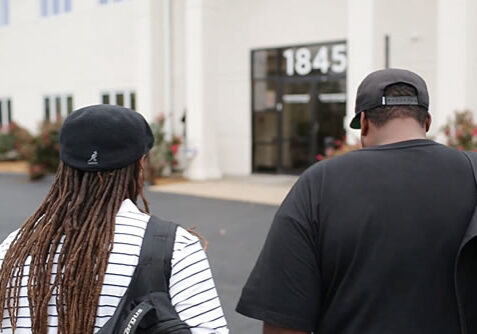 Two people walking into the concordance video